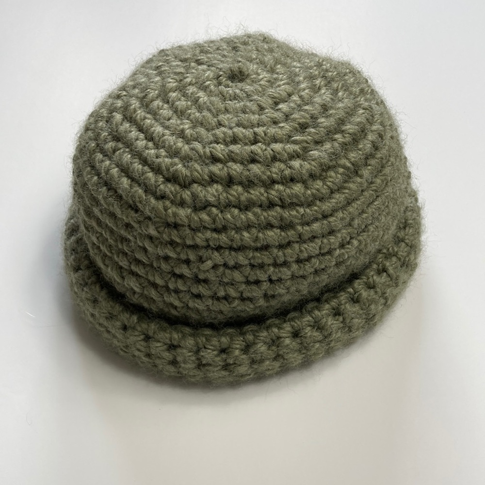 Hand made crocheted beanie NWOT. Color is green and the materials very stretchy!